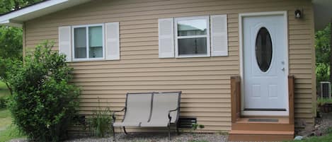 The front of the house with parking at the door.