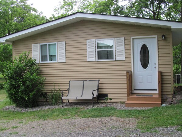 The front of the house with parking at the door.