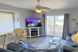 Large Smart TV and electric fireplace for a cozy Living area. 
