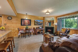 The main living area has a nice cabin feel as you enjoy the big screen tv.