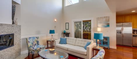 Open floor plan with dining area, living room, and kitchen