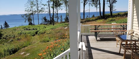 This Island cottage sits upon a high bluff with big views of the Penobscot Bay.