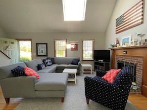 Bright living room with brand new sectional and chair for 2021