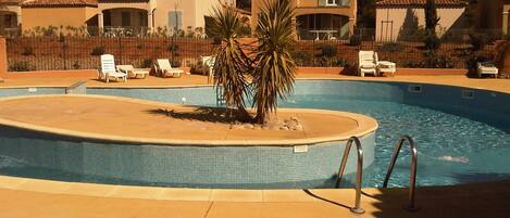 Shared pool heated pool with sun loungers, just a few steps from the apartment 
