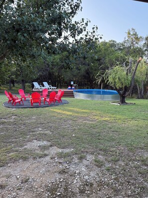 Great outdoor area with Fire pit and cowboy pool for your enjoyment. 