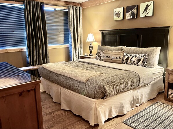 Master bedroom with king bed, ensuite bath, 45” flat screen, and large closet