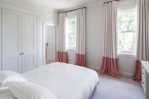 Spacious second bedroom with queen bed and ensuite