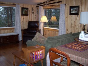 Living/dining area with view windows