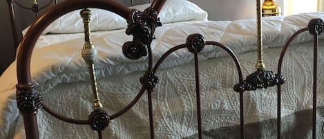 Sweet dreams in this queen size ornate iron bed.