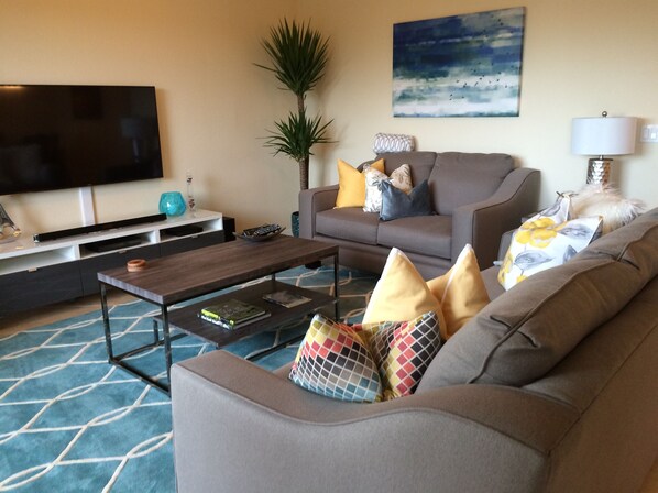 Living Room with Queen size pull out sofa and 55" HD Smart Television