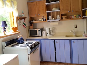 View of kitchen area from the front door. 