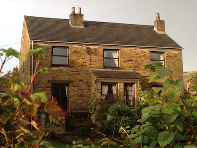 Beechcroft Cottage Reeth, set in two acres garden, river, ponds, amazing views