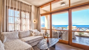 Living room and balcony with sea view