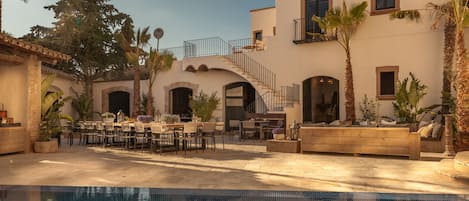 A courtyard view of the villa and infinity pool