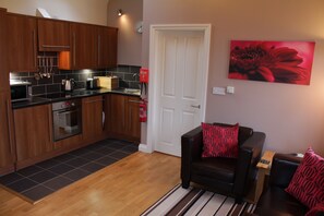 Living space and fitted kitchen in Wendy's Wing