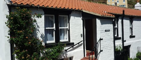 Lovely Longhouse Cottage with small south facing patio garden. 