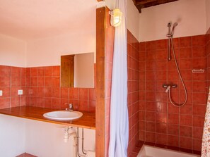 the bathroom, with its shower