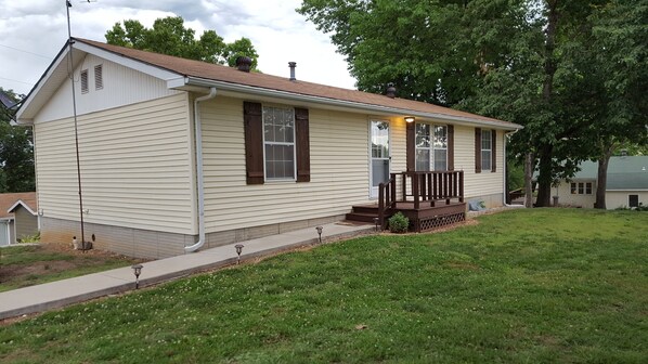 Huge front lawn and parking area.