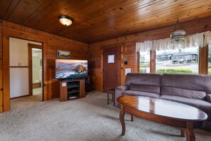The living area has a nice layout with wood fireplace, TV and Wi-Fi