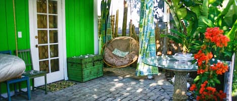 Hanging Furniture on the Cobblestone Porch