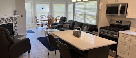 Full view of kitchen and living room - leather sofa and 2 recliners