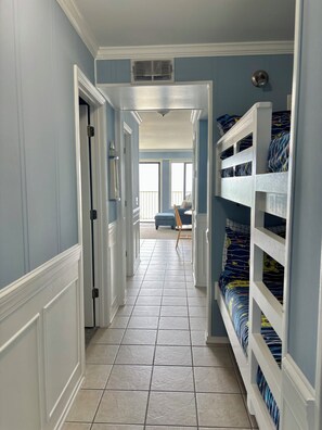 Bunks to the right, bedroom and bathroom to the left