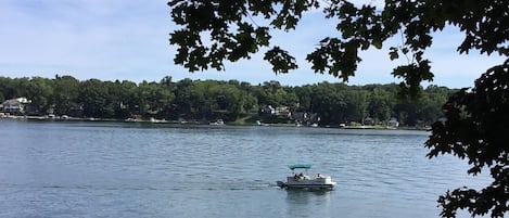 Private sandy beach with pier ,paddleboat and rowboat