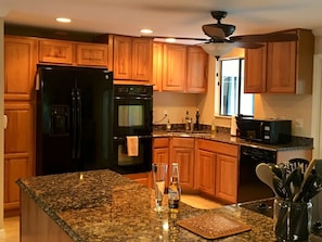 Large, extremely well equipped kitchen with pool views