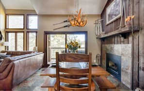 Dining room with its own fireplace and mountain views