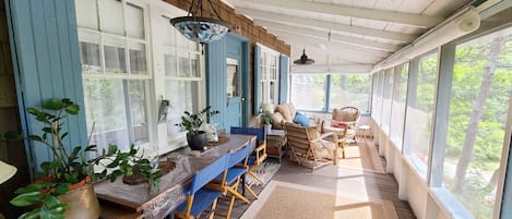 Comfortable front screen porch with seating