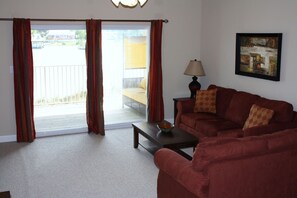 Living room with view of water-Typical 2 BR -All units are furnished similarly