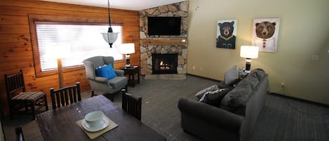 Open living/dining with gas fireplace, vaulted ceiling. Free cable TV, free WiFi