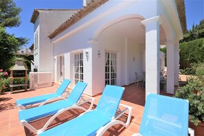 Sun loungers available for guests on the terrace near the pool area