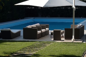 sofa set by the pool