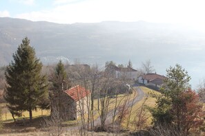 The house nestled on the hillside