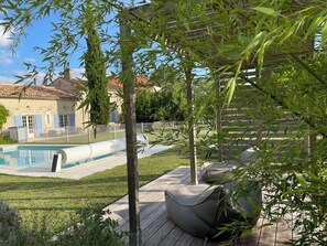 Shaded pergola by the pool