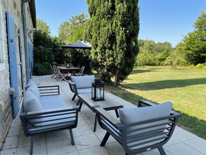 Outdoor seating and dining - overlooking rear garden and swimming pool