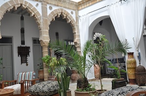 The patio under the sky roof, traditional Essaouira fourniture in thuya