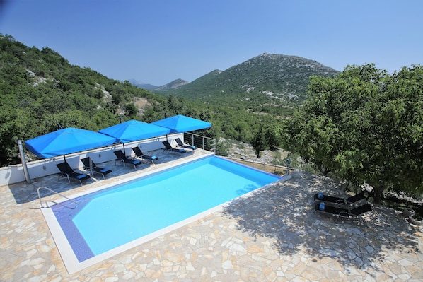 Private heated outdoor pool - view due s/e towards Omis and Cetina river canyon.