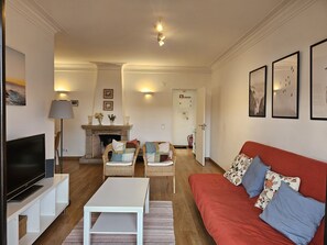 Living room with sofa and dining table for comfortable meals. 