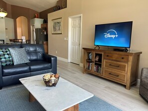 Living room with 50" UHD-UltraHighDef  Smart TV, DVD player. Streaming capable.