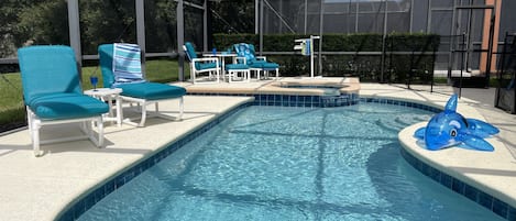 Natural hedges provide extra privacy in this extra large patio with pool and spa