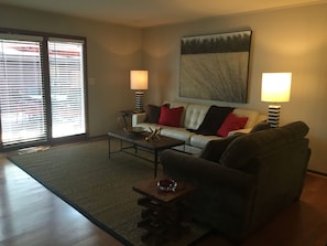 Large family room with French doors leading to large deck.