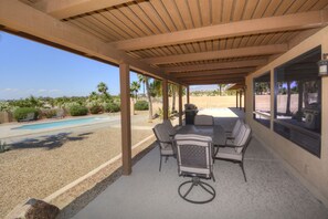 The back porch, very spacey  with BBQ grill.