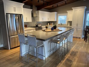 Large kitchen island with seating for six and great for serving your guests