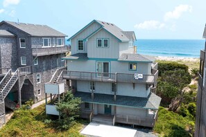 surf-or-sound-realty-9-reflections-drone-front-exterior-2