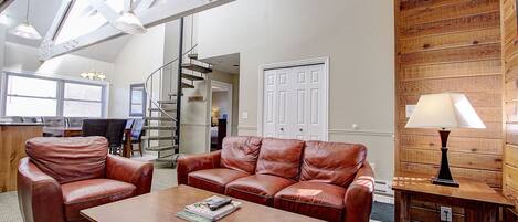 Living room, high ceiling, sky light, w circular stairs to upper BR & bath