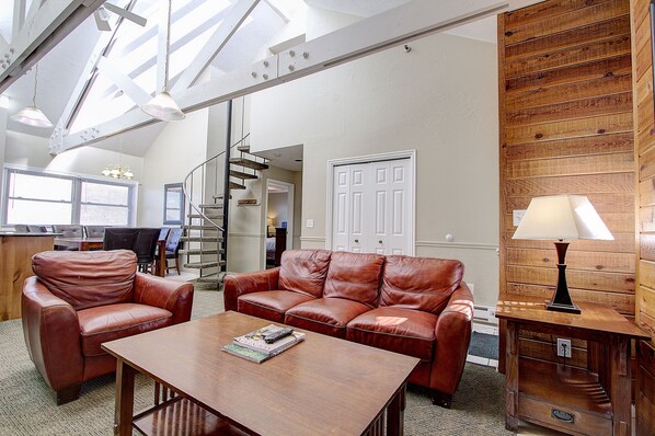 Living room, high ceiling, sky light, w circular stairs to upper BR & bath