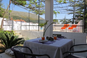 terrace, mountain and city view