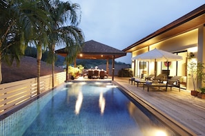 Beautiful teak style sun deck and private swimming pool